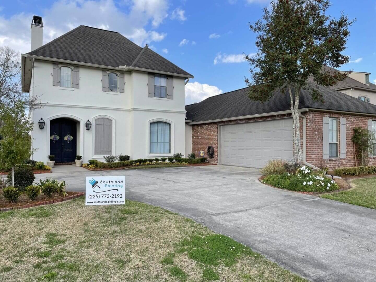 Two-story house with a front yard.